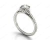 Round Cut Four Claw Set Diamond Ring with Pave Set Diamonds on the Band in 18K White