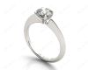 Round Cut Solitaire Diamond Engagement Ring with Four Prong set centre stone and a Knife Edge Band in Platinum