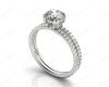 Round Cut Four Double Claw Set Diamond Ring with Pave Set Diamonds Down The Shoulders in Platinum