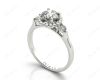 Round Cut Halo Trilogy diamond ring with pave set side stone in 18K White