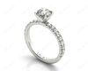 Round cut claw set diamond ring with pave set side stone in Platinum