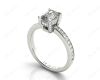 Emerald Cut Four Claw Diamond Ring with grain set side stones in Platinum