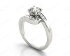 Round Cut Four Claw Set Diamond Ring with Channel Set Stones Down the Shoulders in Platinum