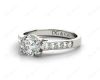 Round Cut 4 Claw Side Stone Engagement Ring with Channel Set Side Stones in Platinum