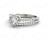 Round Cut Split Shank Diamond Engagement Ring with a Twist Band and Pave Set Side Stones in Platinum