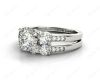 Round Cut Diamond trilogy wedding set rings with claw set side stone in 18K White