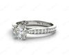 Round Cut Four Claw Set Diamond Ring with Pave Set Stones Down the Shoulders and on Both Sides in Platinum