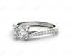 Round Cut Four Claw Set Diamond Ring with Pave Set Diamonds Down the Shoulders in Platinum