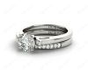 Round cut diamond wedding set rings with channel set shoulders in Platinum