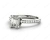 Emerald Cut Four Claw Diamond Ring with grain set side stones in Platinum