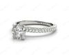 Round Cut claw set diamond ring with micro pave set side stone in Platinum