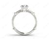 Round Cut Vintage Style Three Stone Engagement Ring with Tapered Baguette Bezel Set and Pavé Set Side Stones in Platinum