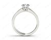 Round cut diamond ring with four claws set centre stone in Platinum