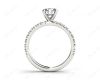 Round cut claw set diamond ring with pave set side stone in Platinum