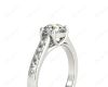 Round Cut 4 Claw Side Stone Engagement Ring with Channel Set Side Stones in Platinum