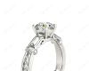 Round Cut Vintage Style Three Stone Engagement Ring with Tapered Baguette Bezel Set and Pavé Set Side Stones in Platinum