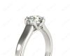 Round Cut Solitaire Diamond Engagement Ring with Twist Six Prong set centre stone in Platinum