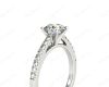 Round Cut Four Claw Set Diamond Ring with Round Pave Set Stones Down the Shoulders in Platinum