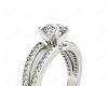 Round Cut 4 Claw Split Shank Engagement Ring with Grain Set Side Stones in Platinum