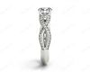 Twist Band Round Cut Four Claw Set Diamond Ring with Pave Set Stones Down the Shoulders In Platinum