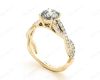 twist Band Round Cut Four Claw Set Diamond Engagement Ring with Pave Set Stones Down the Shoulders in 18K Yellow