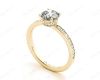 Round Cut Four Claw Set Diamond Ring with Round Pave Set Side Stones in 18K Yellow