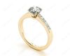 Round cut diamond ring with four claws set centre stone in 18K Yellow