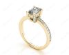 Emerald Cut Four Claw Diamond Ring with grain set side stones in 18K Yellow