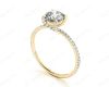 Round Cut Cross Over ring claw set diamond with pave set side stone in 18K Yellow