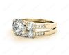 Round Cut Diamond trilogy wedding set rings with claw set side stone in 18K Yellow