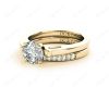 Round cut diamond wedding set rings with channel set shoulders in 18K Yellow