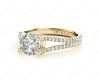 Round cut diamond ring with claw set centre stone in 18K Yellow