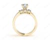 Round Cut Diamond trilogy wedding set rings with claw set side stone in 18K Yellow