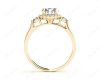 Round Cut Halo Trilogy diamond ring with pave set side stone in 18K Yellow