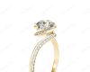 Round Cut Twist band claw set diamond with grain set side stone in 18K Yellow