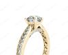 Round Cut Four Claw Set Diamond Ring with Pave Set Stones Down the Shoulders and on Both Sides in 18K Yellow