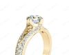 Round Cut Four Claw Set Diamond Ring with Round Cut Diamonds Down the Shoulders in 18K Yellow