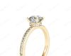 Round Cut Four Claw Set Diamond Ring with Round Pave Set Side Stones in 18K Yellow