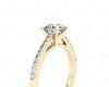 Round Cut Four Claw Set Diamond Ring with Round Pave Set Stones Down the Shoulders in 18K Yellow