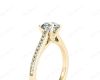 Round Cut Four Claw Set Diamond Ring with Round Cut Channel Diamonds Down the Shoulders and on the Setting in 18K Yellow