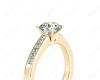 Round cut diamond ring with four claws set centre stone in 18K Yellow