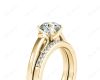 Round cut diamond wedding set rings with channel set shoulders in 18K Yellow