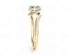 Round Cut Twist band claw set diamond with grain set side stone in 18K Yellow