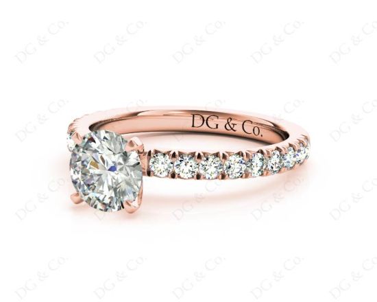 Round cut claw set diamond ring with pave set side stone in 18K Rose