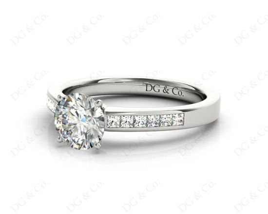 Round cut diamond ring with four claws set centre stone in 18K White