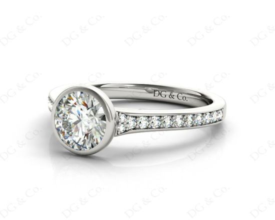 Round Cut Bezel Set Diamond Ring with Channel Set Diamonds Down the Shoulders In Platinum