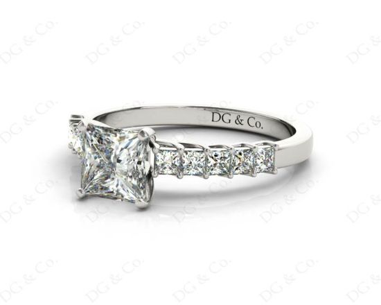 Princess Cut Four Claw Set Diamond Ring with Princess Cut Stones Down the Shoulders and Brilliant Stones on Sides. in 18K White