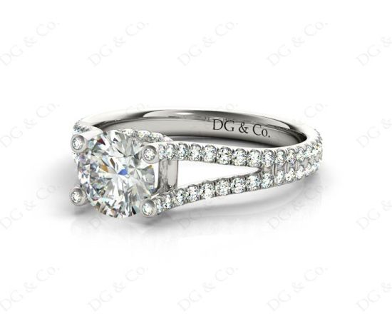 Round cut diamond ring with claw set centre stone in Platinum