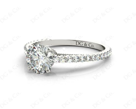 Round Cut Four Claw Set Diamond Ring with Side Halo and Round Cut Diamonds Claw Set on the Band. in 18K White