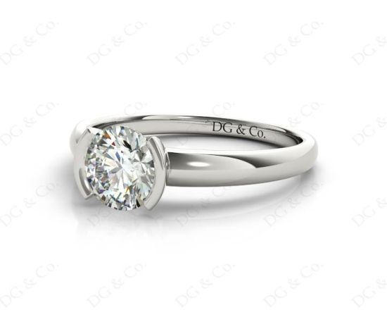 Round Cut Bezel Set Diamond Ring on a Plain Band. in 18K White